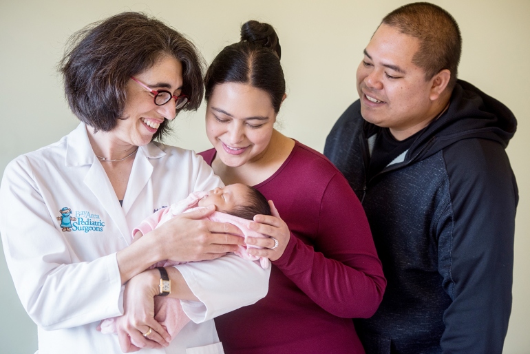 Tippi MacKenzie (left), MD, of UCSF Benioff Children’s Hospital San Francisco, visits with newborn Elianna, who received a stem cell transplant before birth