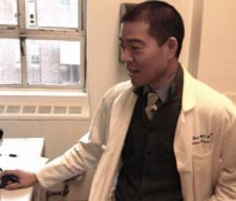 Elvin Geng, MD, in his office