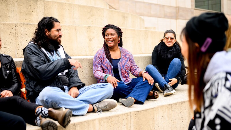 People sitting on steps outside